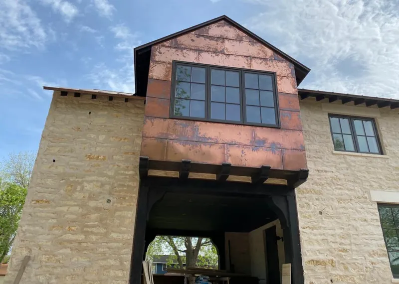 Copper metal panel facade on a stone building for Skylight Installation in Wood-Ridge