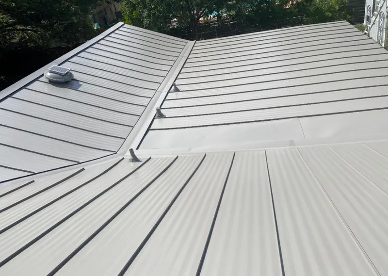 Solar attic fan installed on a metal roof for Roof Ventilation in Wood-Ridge